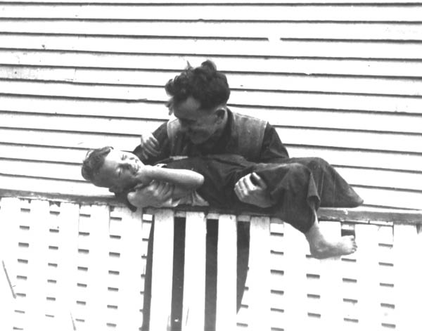 143: Gerry McCarthy and Cam Dunphy, on McCarthy's porch railing. (circa 1942)  [courtesy of Madonna (Healey) McCarthy]  - Gerry son of James McCarthy &amp;amp; Julia Reddy; Cam son of Thomas Dunphy &amp;amp; Anne Carroll